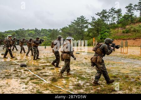 U.S. Marines with 1st Battalion, 6th Marine Regiment, conduct marksmanship drills on Camp Schwab, Okinawa, Japan, March 13, 2020. One of the drills Marines utilize to maintain their lethality involves firing at close ranges as well as gradual movements towards a target to simulate closing with the enemy. This drill is being executed by an activated reserve unit currently attached to 3rd Marine Division as part of the unit deployment program. (U.S. Marine Corps photo by Lance Cpl. Ujian Gosun)