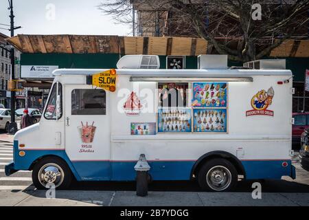 Brooklyn, USA . 18th Mar, 2020. With New York City public school students out of school because of the Coronavirus, Mr. Softee ice cream trucks are one of the few businesses still thriving like this one in the Park Slope neighborhood of Brooklyn on March 18, 2020. (Photo by Gabriele Holtermann-Gorden/Sipa USA) Credit: Sipa USA/Alamy Live News Stock Photo
