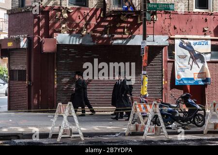 Brooklyn, USA . 18th Mar, 2020. A group of young Hasidic men in the Borough Park neighborhood of Brooklyn on March 18, 2020. At least 100 people have tested positive for Coronavirus in the predominantly Hasidic community since Friday. (Photo by Gabriele Holtermann-Gorden/Sipa USA) Credit: Sipa USA/Alamy Live News Stock Photo