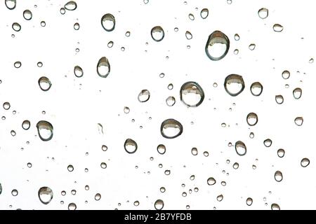 Drops of rain on glass, macro, different shapes. Background Stock Photo