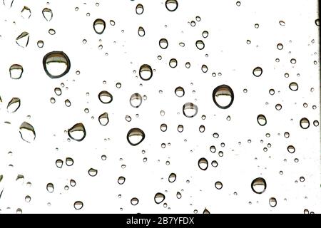Drops of rain on glass, macro, different shapes. Background Stock Photo