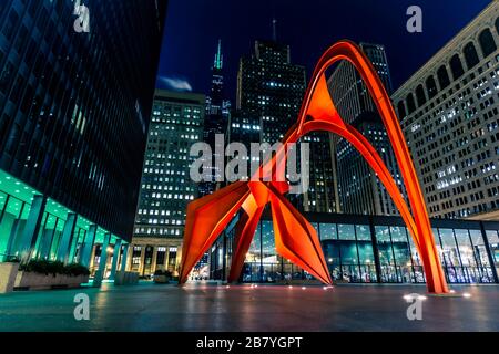 Chicago, Illinois, United States - March 15, 2020: Alexander Calder's Flamingo statue on permanent display in Federal Plaza in front of Kluczynski Fed
