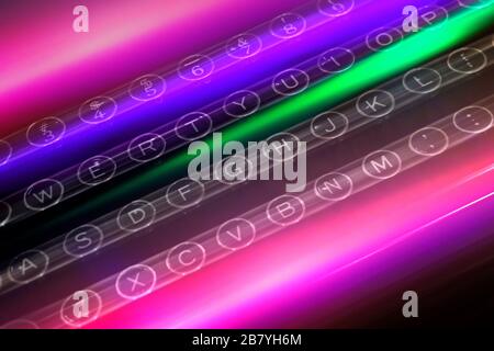 Colorful light trails over keys of typewriter Stock Photo