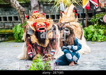 The Barong and his friend the monkey on stage at the Batubulan barong dance, Bali Island, Indonesia Stock Photo