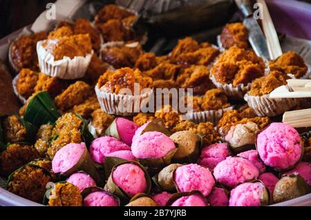 Colorful cupcakes on sale at the produce market in Ubud, Bali Stock Photo