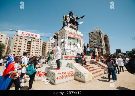 SANTIAGO, CHILE-OCTOBER 29, 2019 - Demonstrators gather at the monument to General Baquedano to begin a march against the government of Sebastian Pine Stock Photo