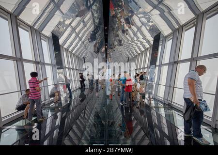 Visitors taking in views of Shanghai from the observation deck of the Shanghai World Financial Center in Shanghai, China. Stock Photo