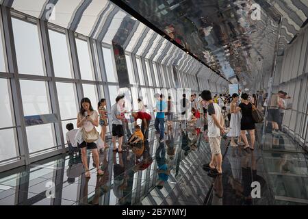 Visitors taking in views of Shanghai from the observation deck of the Shanghai World Financial Center in Shanghai, China. Stock Photo