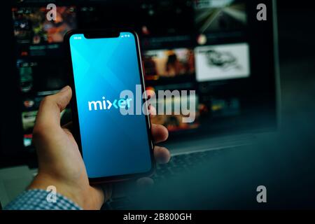 Bishkek, Kyrgyzstan - March 14, 2020: Streaming service. Iphone in hand with Mixer on screen. Stock Photo