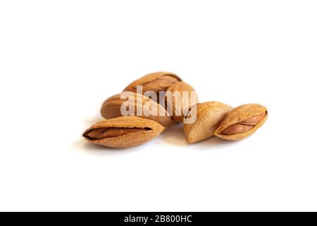 almonds nuts in their skins and peeled isolated on white background grade paper almond  Stock Photo