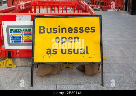 Businesses Open Sign Amid Construction, sign, yellow, black border. Southend, UK Stock Photo