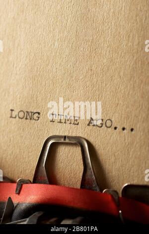 The sentence, Long Time Ago, written with a typewriter. Stock Photo