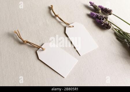 Blank gift tags mockup - two white thank you wedding birthday tags with lavender and twine Stock Photo