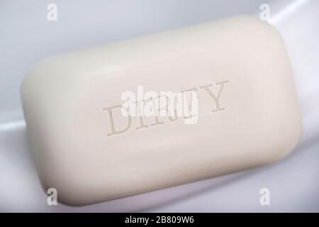 A bar of soap with the word Dirty Stock Photo