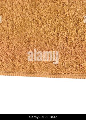 Textured brown towel closeup. Brown towel textures fabric background. Texture brown towel  isolated on white  background. Copy space for your commerci Stock Photo