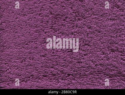 Violet fibers towel texture. Violet  bath towel background. Ultra violet towel texture background Stock Photo