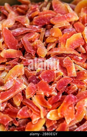 Yellow and orange dried papaya slices background Stock Photo