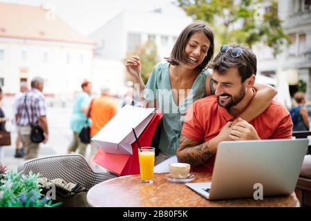Couple having fun at a restaurant. Shopping, date, work, happy people concept. Stock Photo