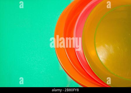 Aqua menthe color background with colorful plates Stock Photo