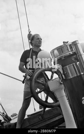 Helmsman on board the J Class yacht 'Velsheda' (K7): sailing in the Solent after first refit, summer 1991.  Archive black and white film photograph Stock Photo