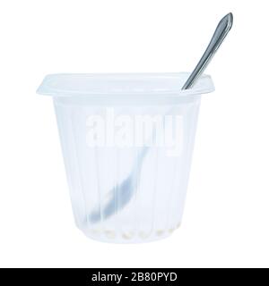 Empty cup of yogurt with a spoon. On a white background. Stock Photo