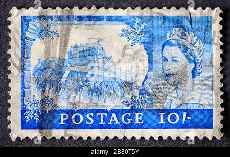Vintage British ten shilling stamp shows Edinburgh Castle and portrait of Queen Elizabeth II, circa 1967 Stock Photo