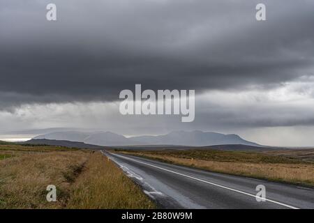 storm comming up over a moss covered lava field in the highlands of Iceland Stock Photo