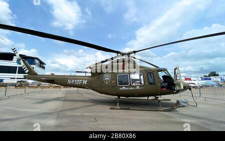 Singapore - Feb 12, 2020. Subaru Bell 412EPX helicopter standing for display in Changi Air Base. Defense costs are increasing, especially in East Asia Stock Photo