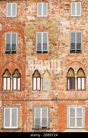 Typical shuttered windows in Piazza San Michele, Lucca, Tuscany, Italy. Stock Photo