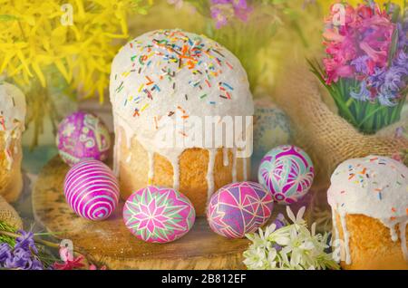Ukrainian traditional Easter bread paska or kulich. Easter  eggs with flower blossom.  Homemade Easter bread and painted eggs Stock Photo