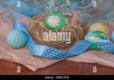 Easter background with snowdrops, eggs and ribbon Stock Photo