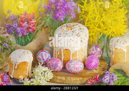 Cake with sprinkles and easter eggs. Easter cake by festive attributes Stock Photo
