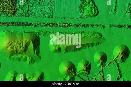 DEM - digital elevation model. Product made after proccesing pictures taken from a drone. It shows excavation site with piles of aggregates Stock Photo