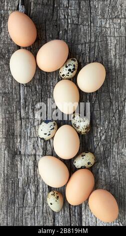 Egg composition on textured wood background, copy space, closeup, vertical, flat lay, from above top view, easter concept and design Stock Photo