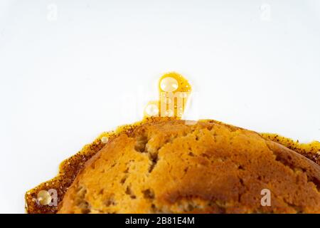 A cookie cake with peanut butter and caramel on white background with copy space - angled view Stock Photo
