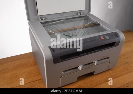 the Broken old office printer and scanner Stock Photo