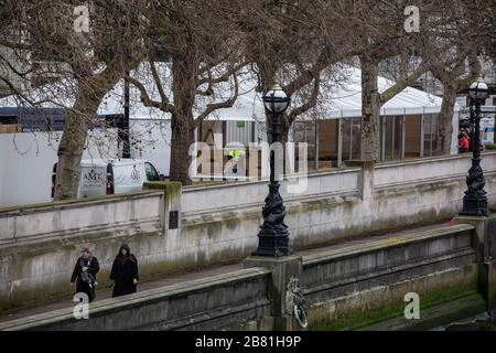 London, UK. 19th Mar, 2020. Make-shift Mortuary built on the site of St Thomas' Hospital, Westminster Bridge as London braces for lockdown as Government prepares emergency Coronavirus Bill. Thursday 19th March 2020, Westminster, London, UK The Government is drawing up sweeping plans to enforce the emergency closure of restaurants, bars, pubs and cinemas in the capital and restrict the use of public transport to only essential 'key workers'. The measure would put hundreds of thousands of people out of work and effectively turn London into a ghost town. Credit: Jeff Gilbert/Alamy Live News