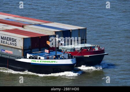 Two containerships in the water of the Maas in Rotterdam, The Netherlands on their way to the inland Stock Photo