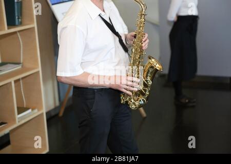 Close up of Young Saxophone Player hands playing alto sax musical instrument Stock Photo