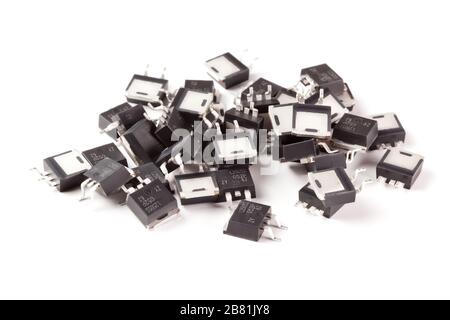 Various electronic components, D2Pack case transistors close-up on white background. Stock Photo