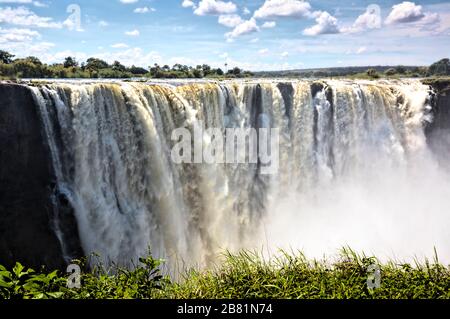 The majestic Victoria Falls in full spate in April at the end of the rainy season Stock Photo