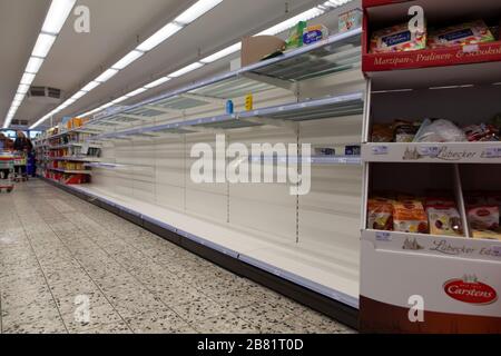 Empty shopping shelves during corona crisis. Stock Photo