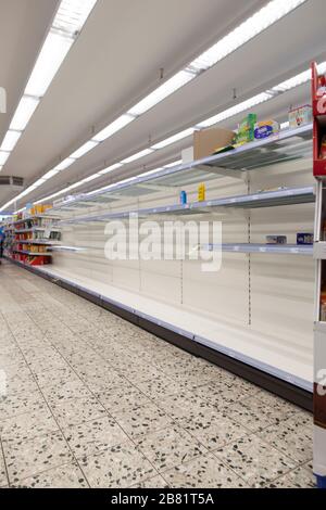 Empty shopping shelves during corona crisis. Stock Photo