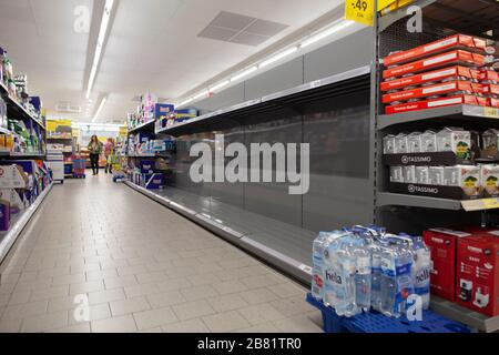 Empty shopping shelves during corona crisis. Stock Photo