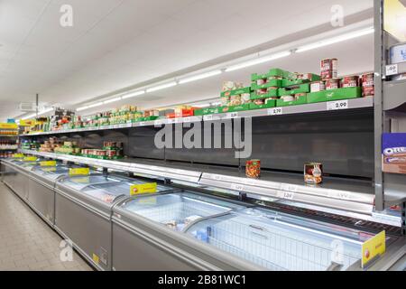 Empty shopping shelves during corona crisis. Stock Photo