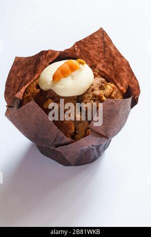 Carrot cake muffin fresh from M&S in-store bakery isolated on white background Stock Photo