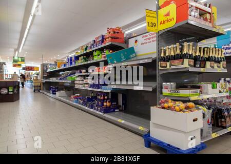 Empty shopping shelves during corona crisis. Stock Photo