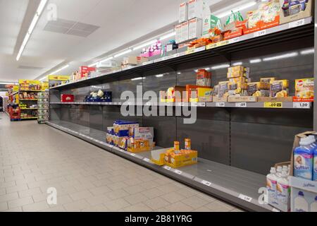 Empty shopping shelves during corona crisis. Stock Photo