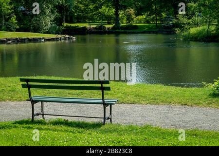 Empty bench with a view of a lake. Stock Photo