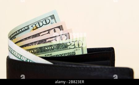 American dollars in a black leather wallet Stock Photo